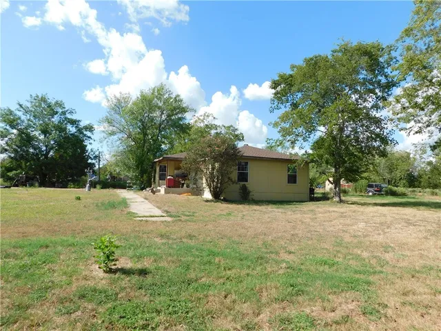 a house view with a garden space
