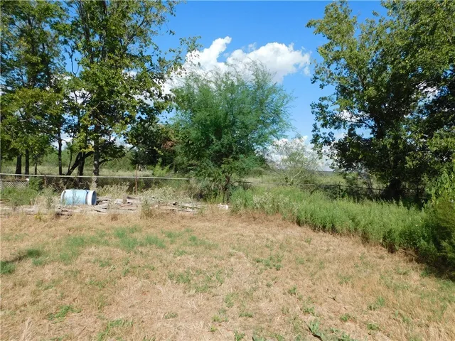 a view of a lake with a yard