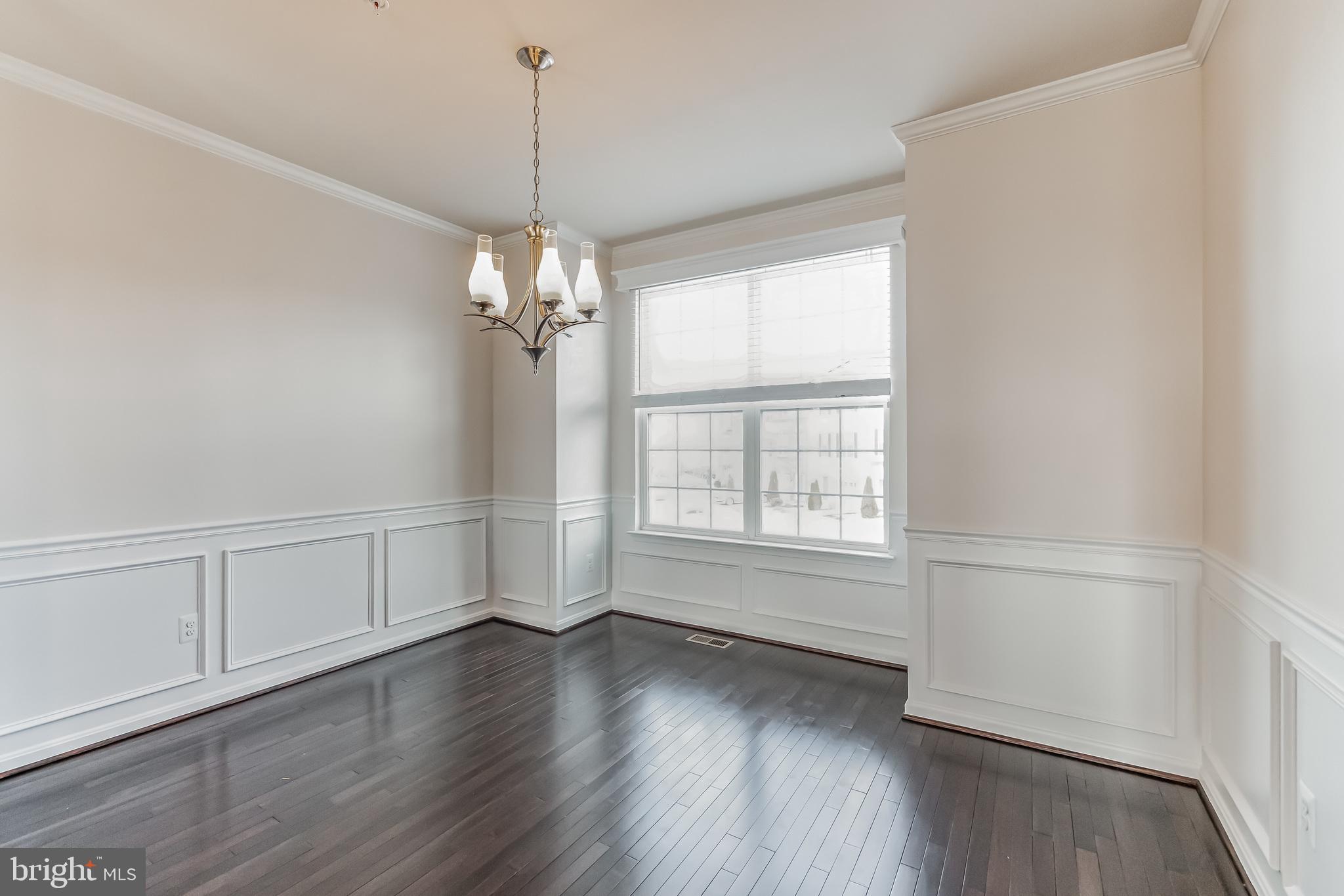 7652 Town View Drive Dundalk, MD 21222 - Photo 11 of 33 wooden floor in an empty room with a window