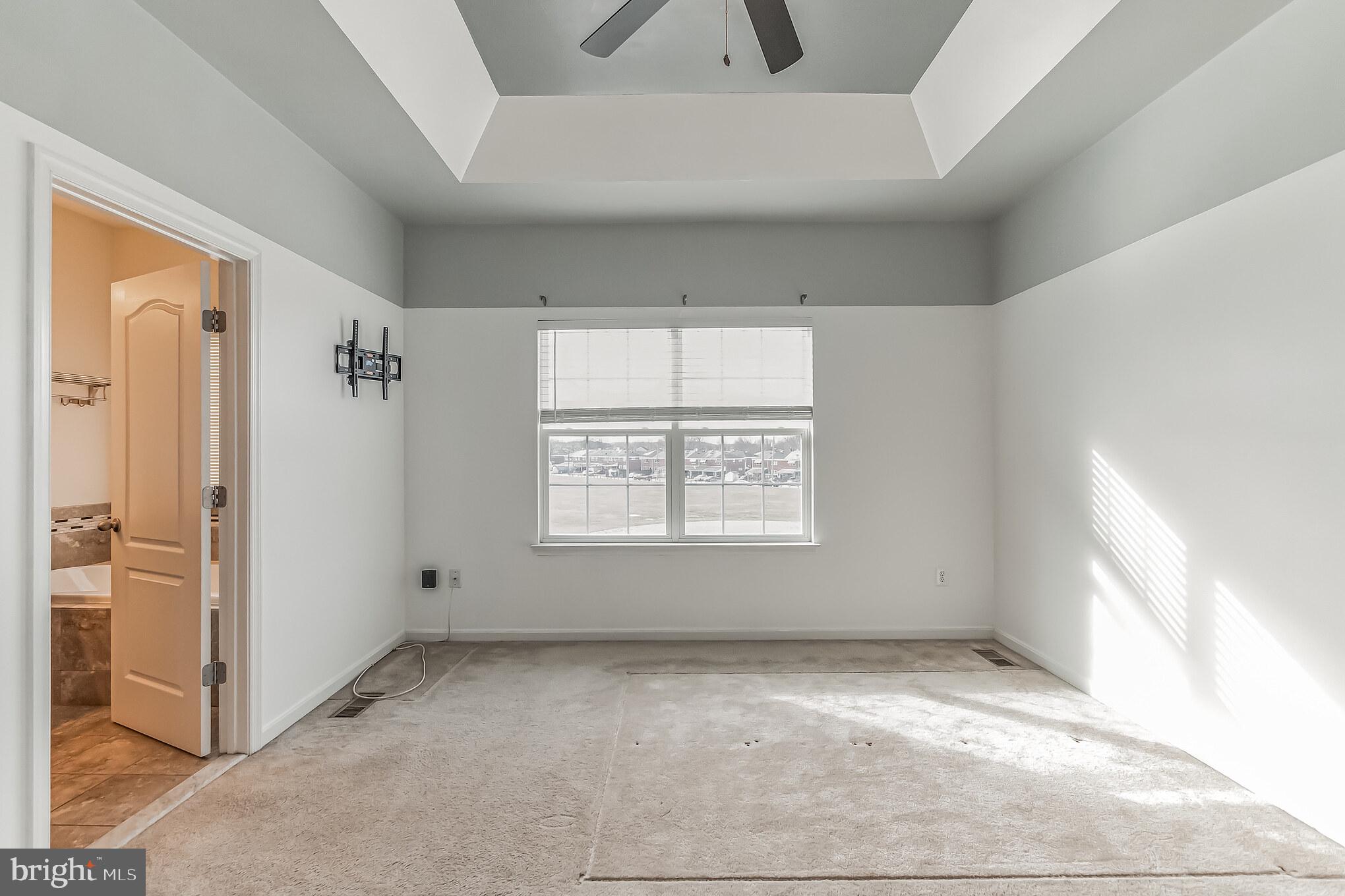7652 Town View Drive Dundalk, MD 21222 - Photo 17 of 33 an empty room with windows and closet