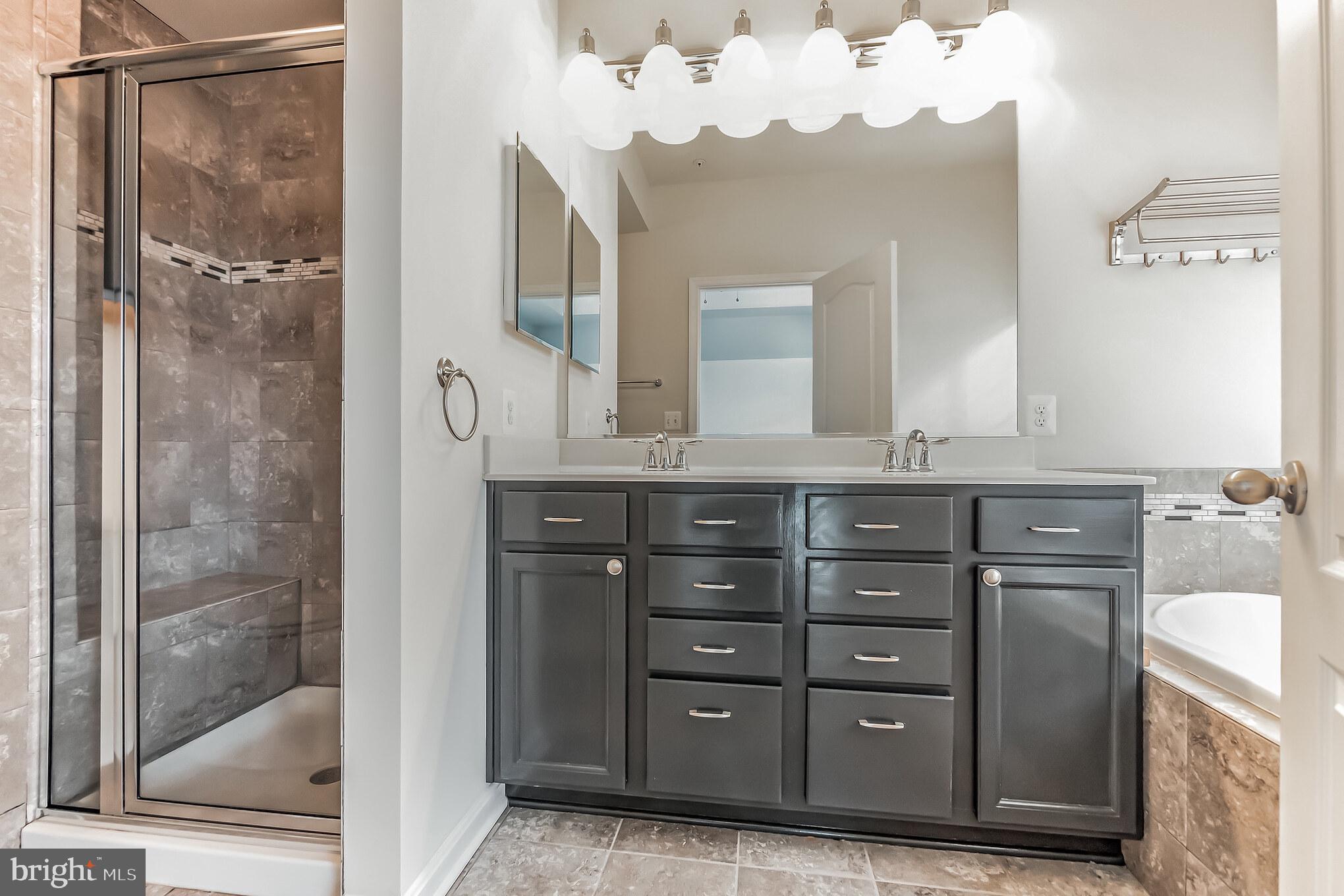 7652 Town View Drive Dundalk, MD 21222 - Photo 19 of 33 a bathroom with a sink and a mirror