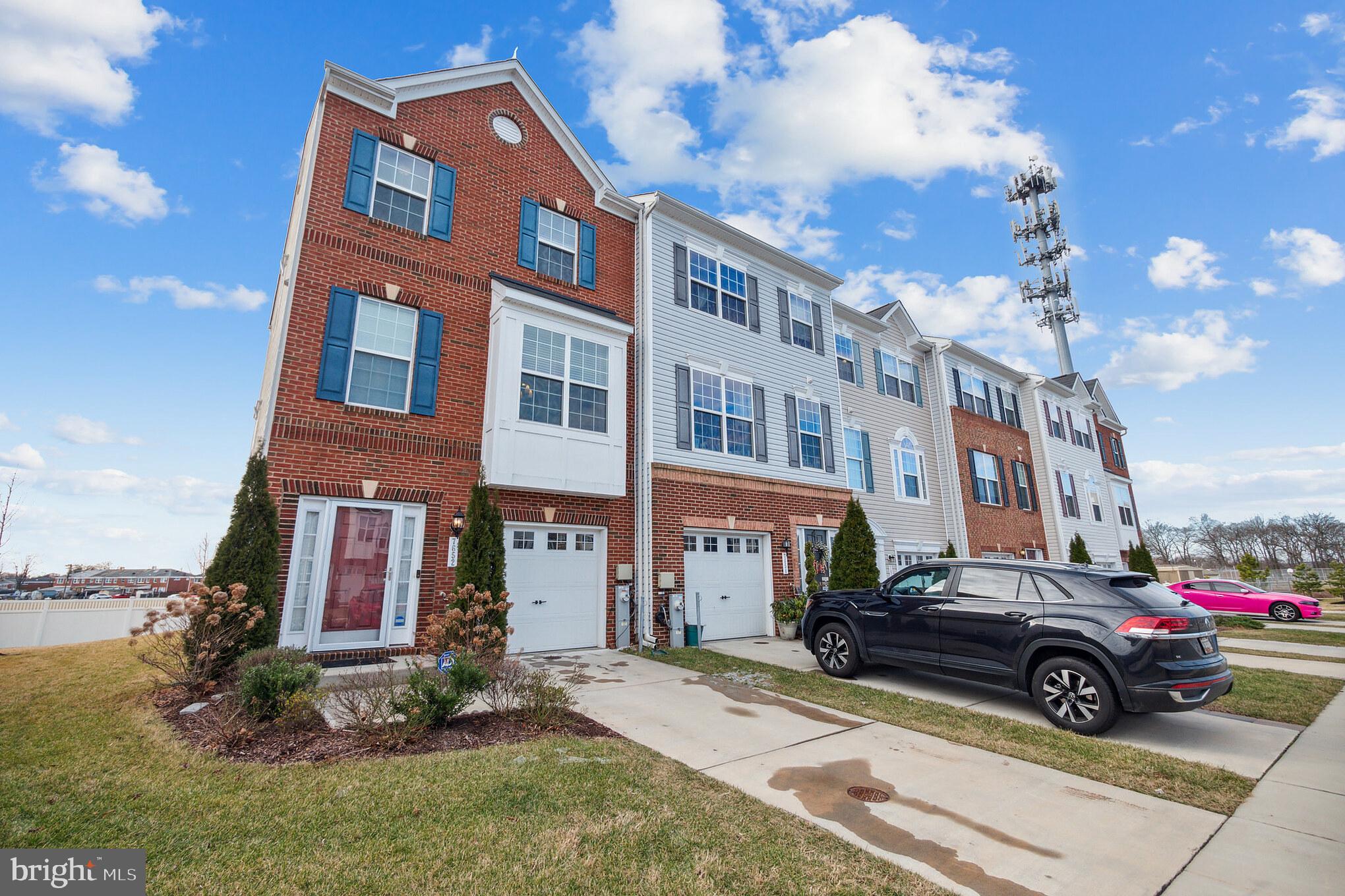 7652 Town View Drive Dundalk, MD 21222 - Photo 2 of 33 a car parked in front of a brick house