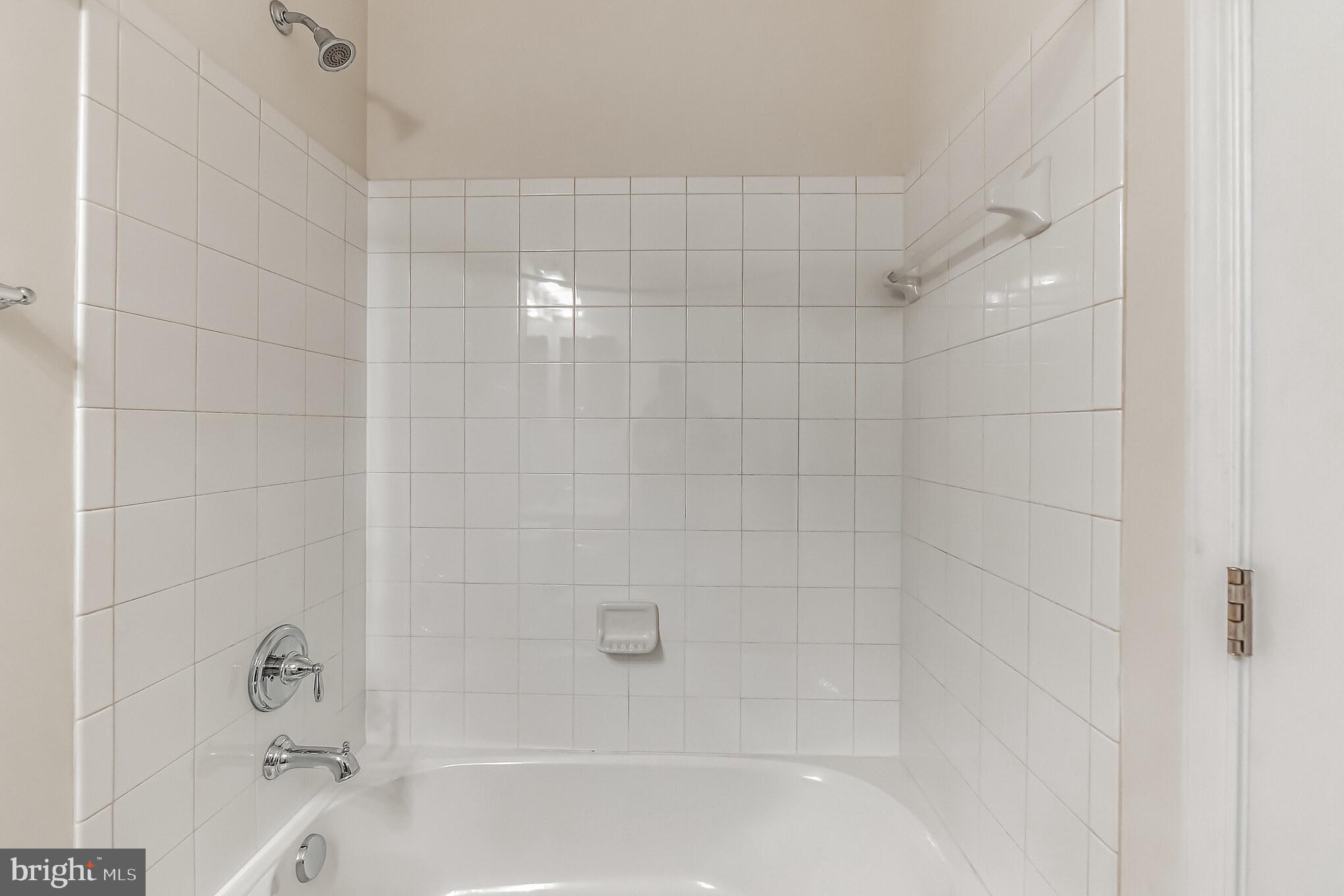 7652 Town View Drive Dundalk, MD 21222 - Photo 25 of 33 a bathroom with a shower and bathtub