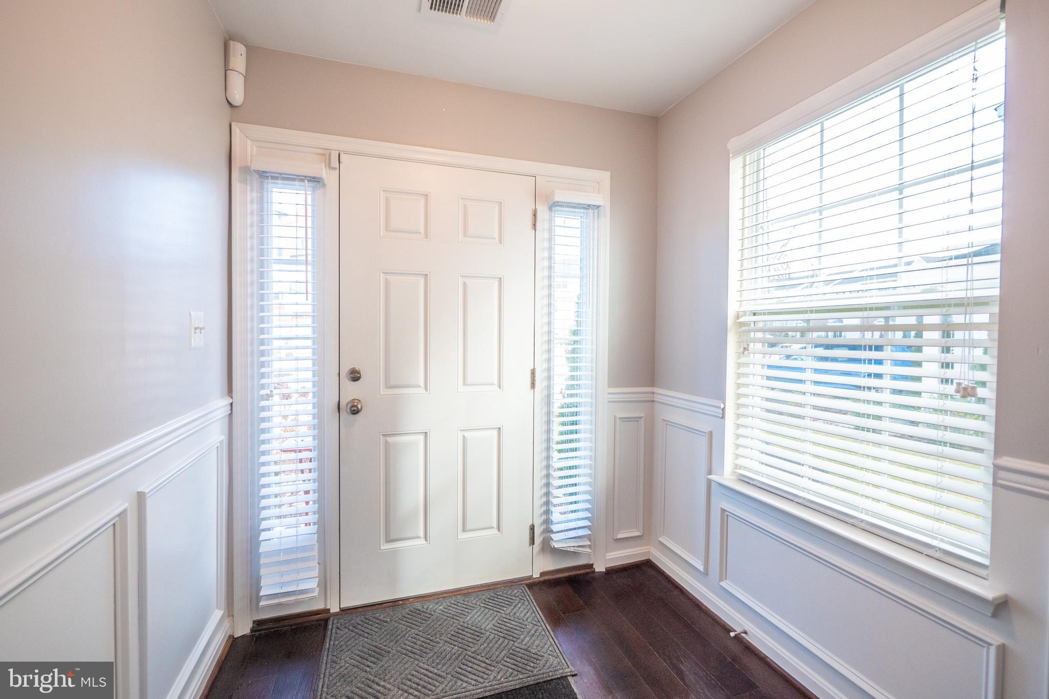 7652 Town View Drive Dundalk, MD 21222 - Photo 3 of 33 a view of empty room with wooden floor and fan