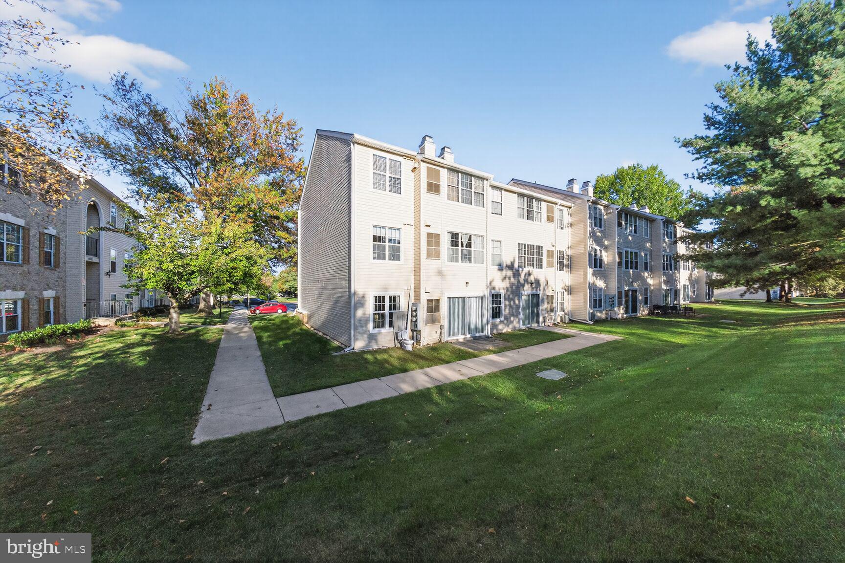 14901 McKisson Court, Unit 7CC Silver Spring, MD 20906 - Photo 19 of 34 a view of a building with a yard