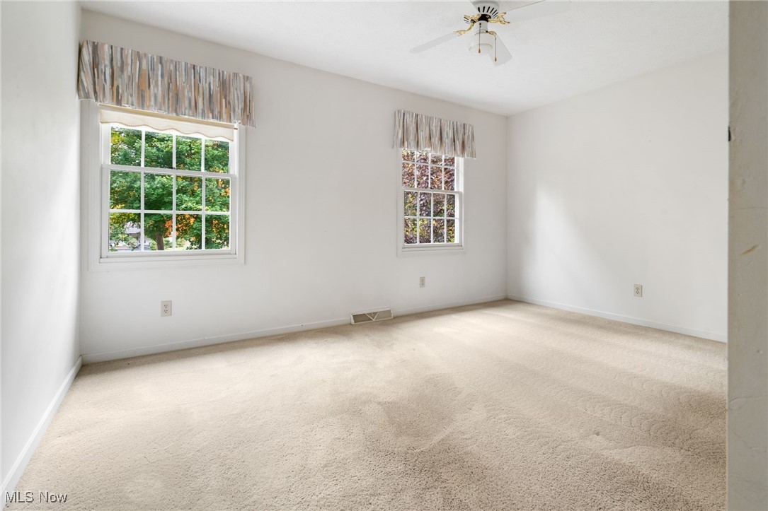 4057 Etter Road Mogadore, OH 44260 - Photo 27 of 41 Carpeted spare room with ceiling fan