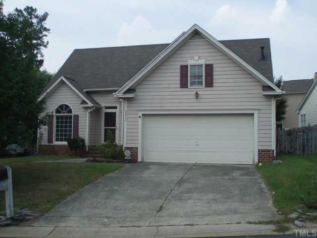 5212 Sutter Way Raleigh, NC 27613 - Photo 1 of 1 a front view of a house with a yard and garage