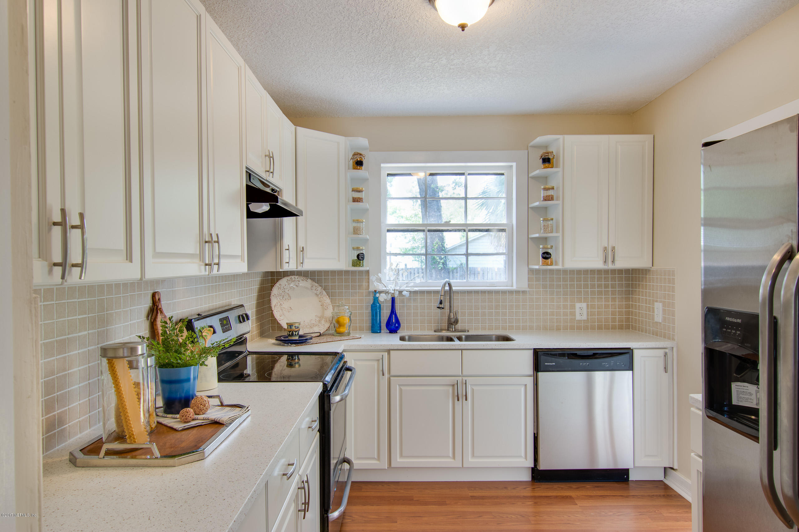 4066 Dover Road Jacksonville, FL 32207 - Photo 6 of 21 a kitchen with white cabinets and sink