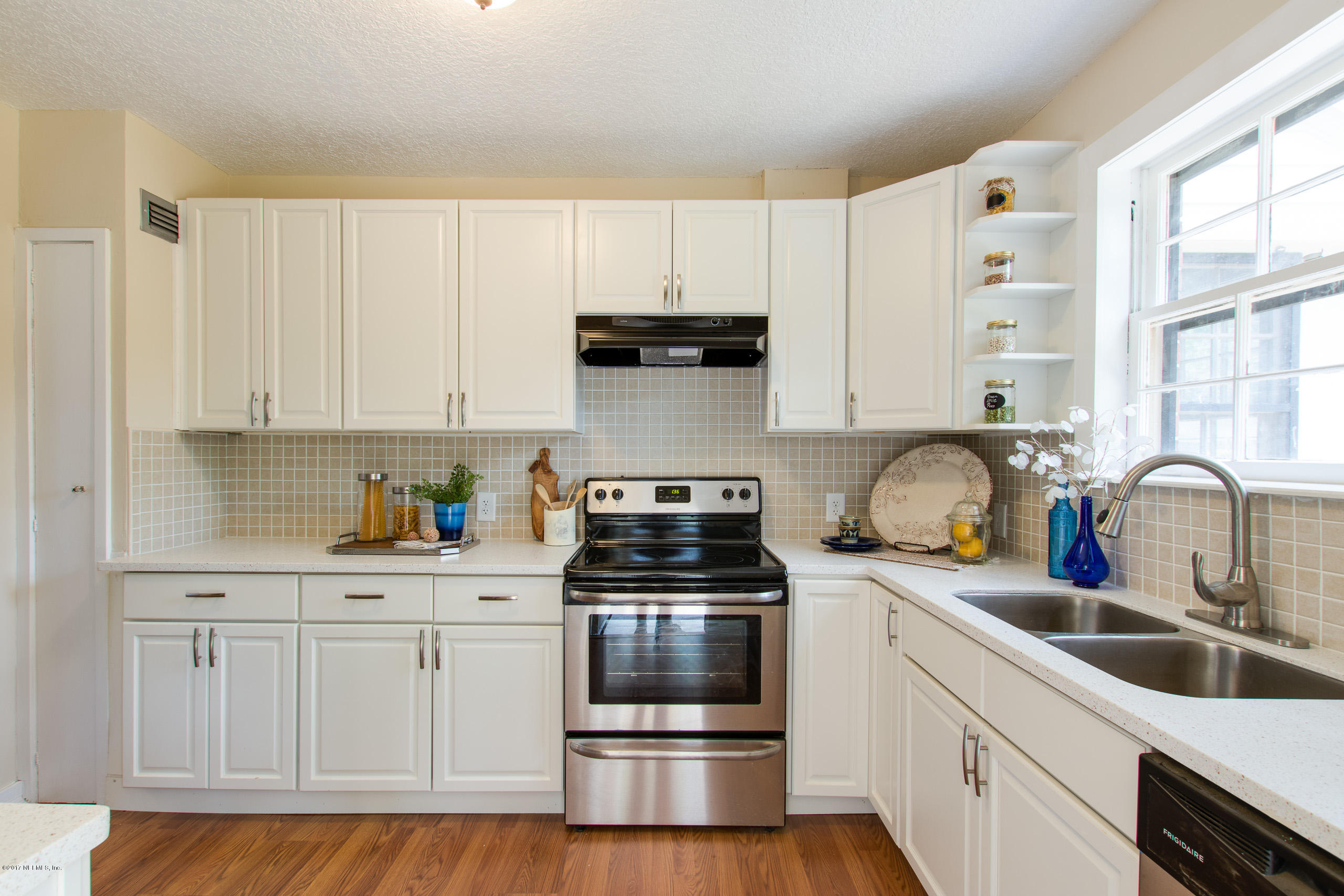 4066 Dover Road Jacksonville, FL 32207 - Photo 8 of 21 a kitchen with granite countertop white cabinets and stainless steel appliances