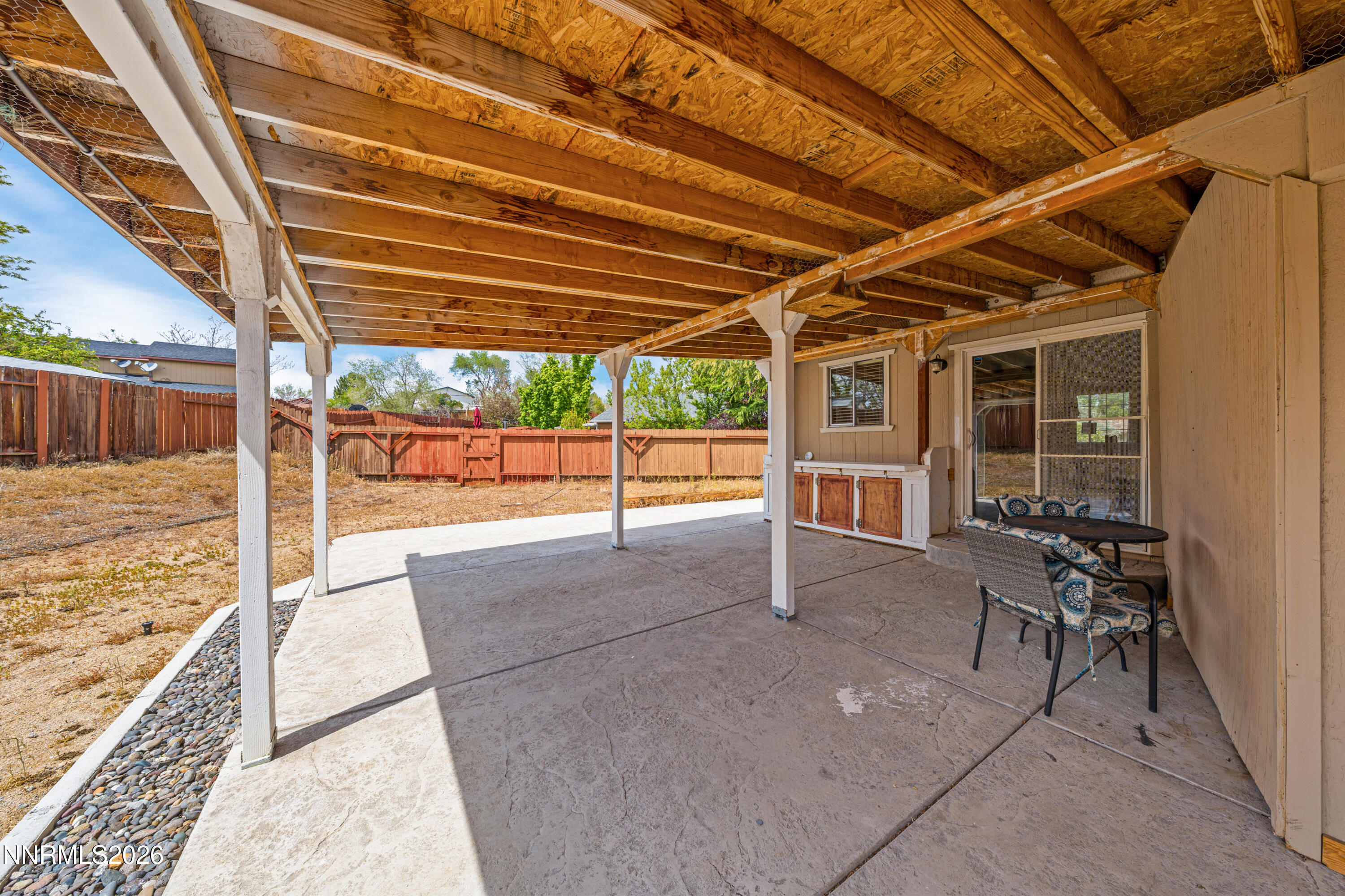 6370 Mono Court Sun Valley, NV 89433 - Photo 17 of 22 a view of a porch with furniture and next to a yard