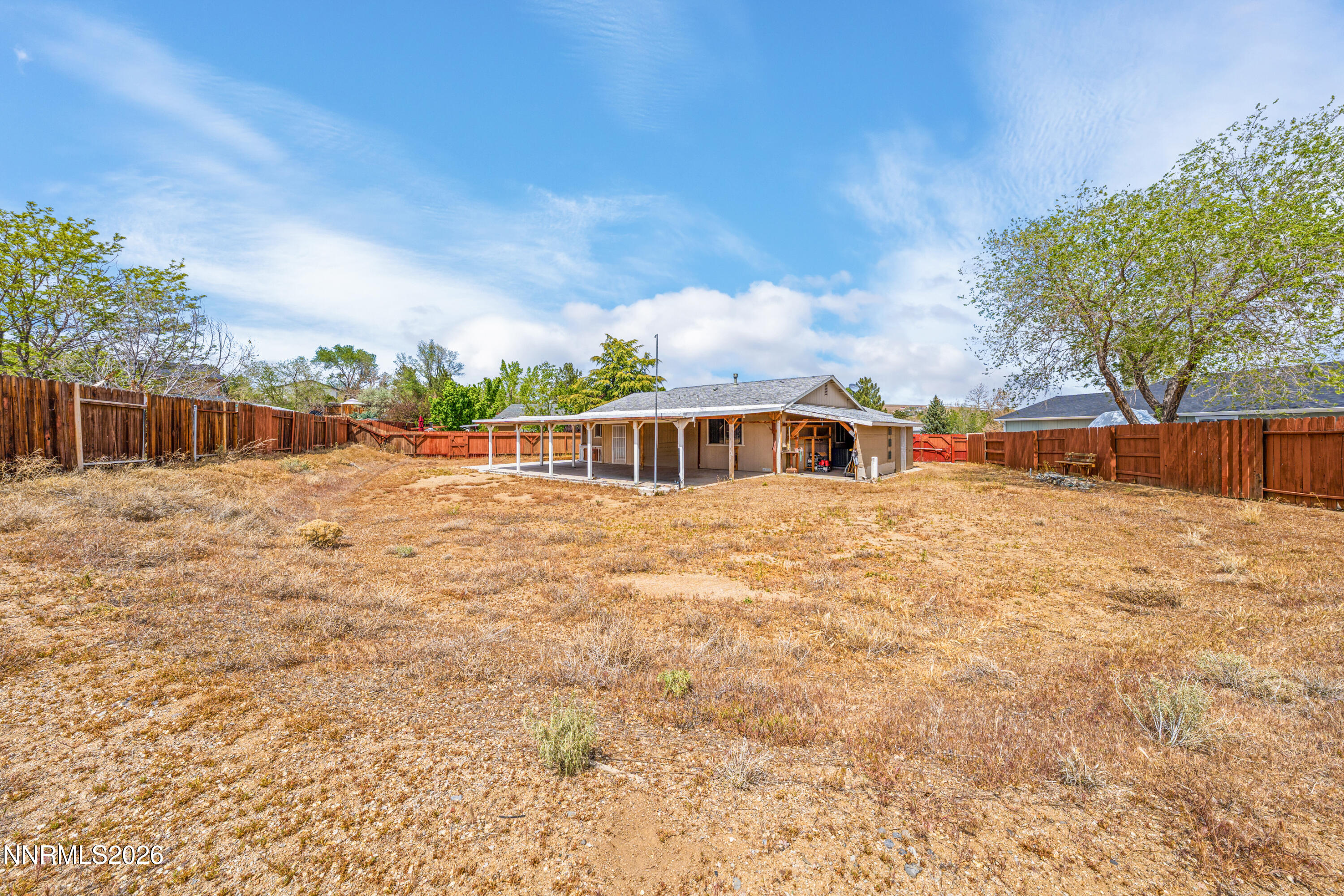 6370 Mono Court Sun Valley, NV 89433 - Photo 18 of 22 a front view of a house with a yard