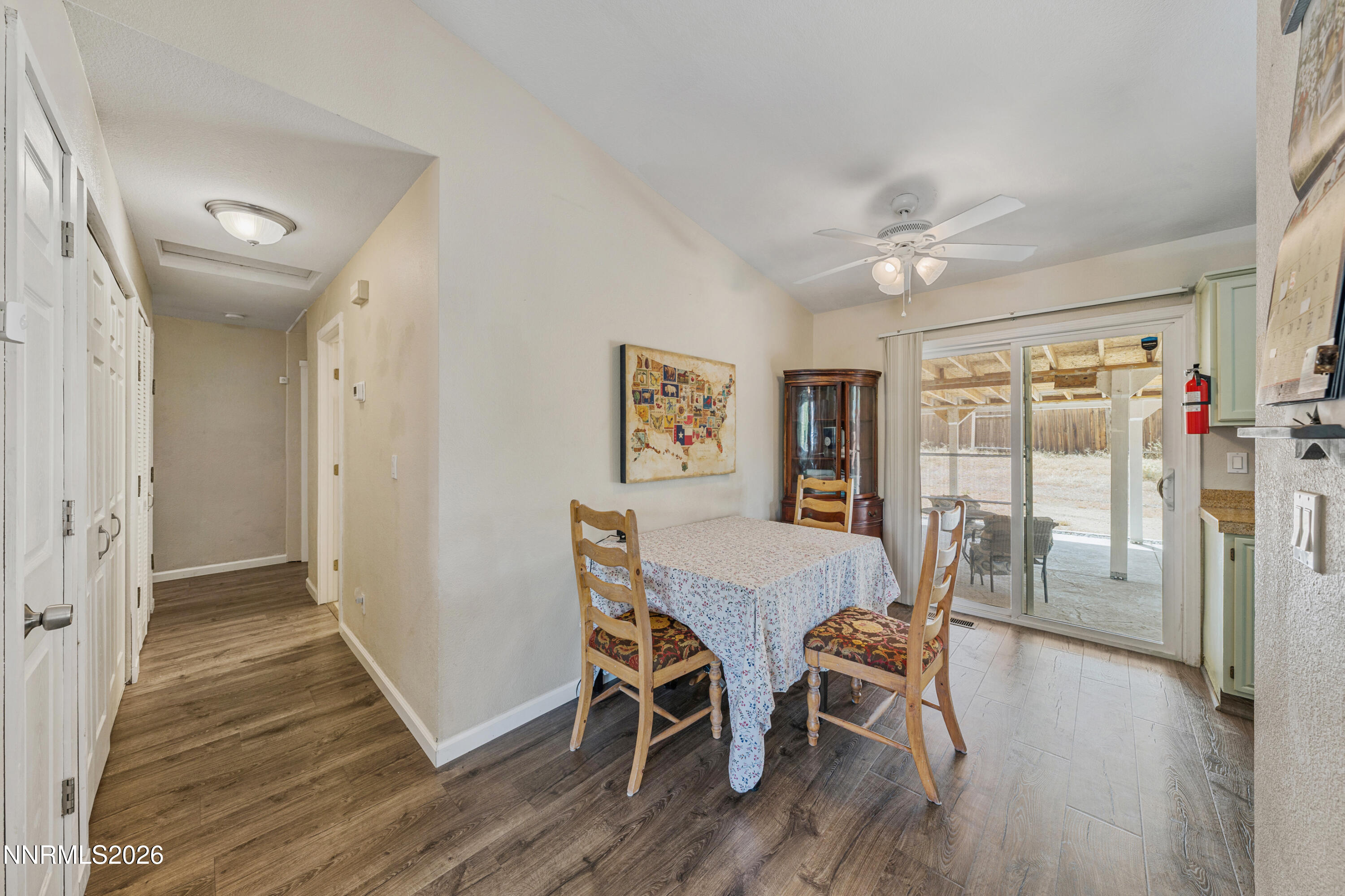 6370 Mono Court Sun Valley, NV 89433 - Photo 6 of 22 a view of a dining room with furniture window and wooden floor