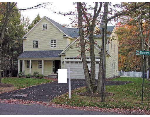 12 Hickory Road Wellesley, MA 02482 - Photo 3 of 17 a front view of a house with a yard
