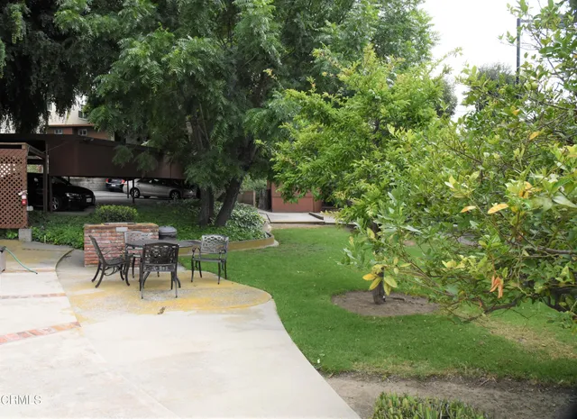 a view of a table and chairs in the garden