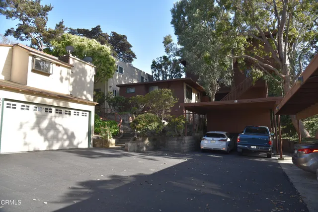a view of a car parked in front of a house