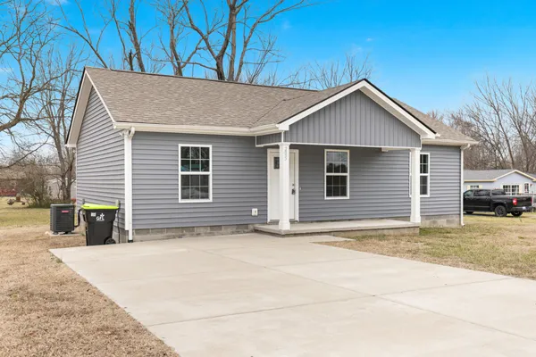 a view of garage and yard