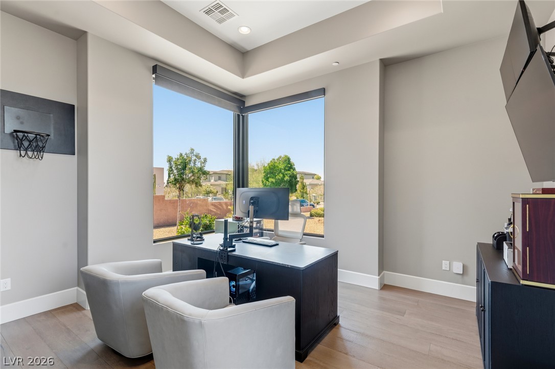 5 Crystal Tree Pass Henderson, NV 89052 - Photo 25 of 67 An inviting home office boasts a corner window with views and recessed lighting.