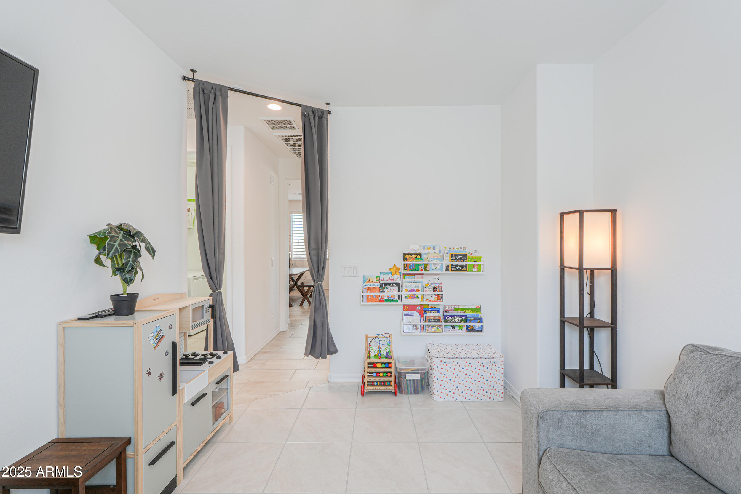 44202 West Palo Olmo Road Maricopa, AZ 85138 - Photo 12 of 32 a bedroom with furniture and a potted plant