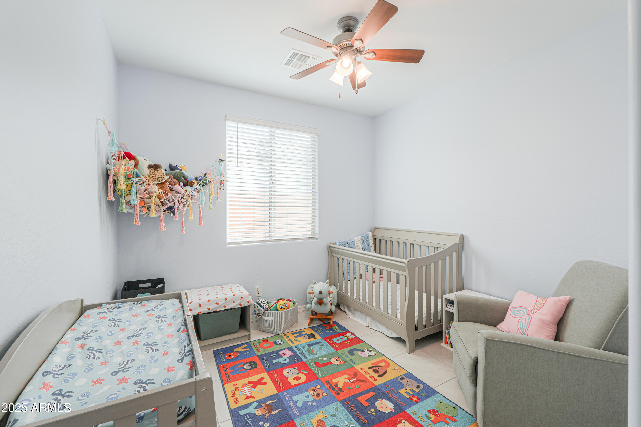 44202 West Palo Olmo Road Maricopa, AZ 85138 - Photo 19 of 32 a bedroom with furniture and a window