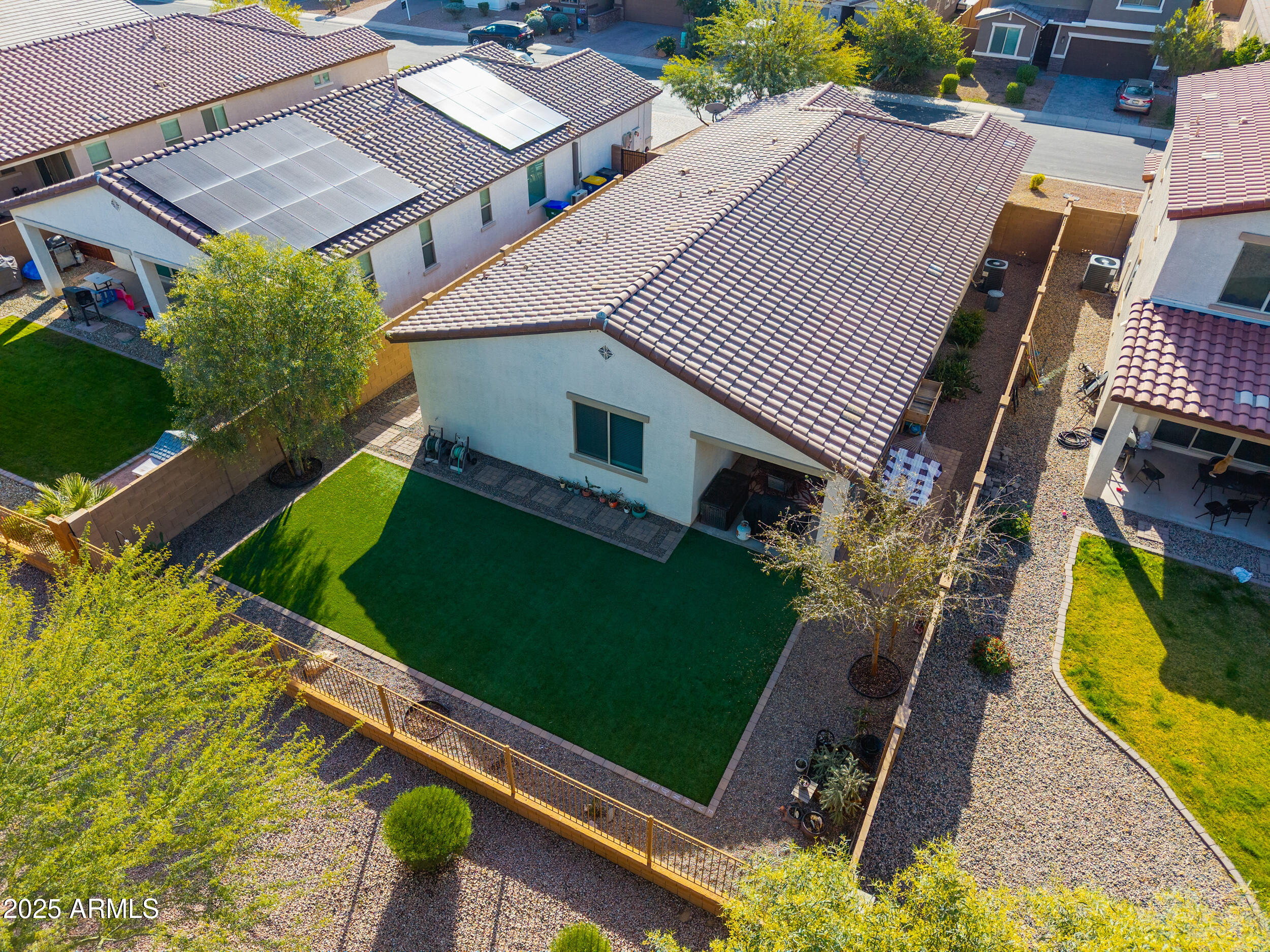 44202 West Palo Olmo Road Maricopa, AZ 85138 - Photo 29 of 32 an aerial view of a house with a garden and trees