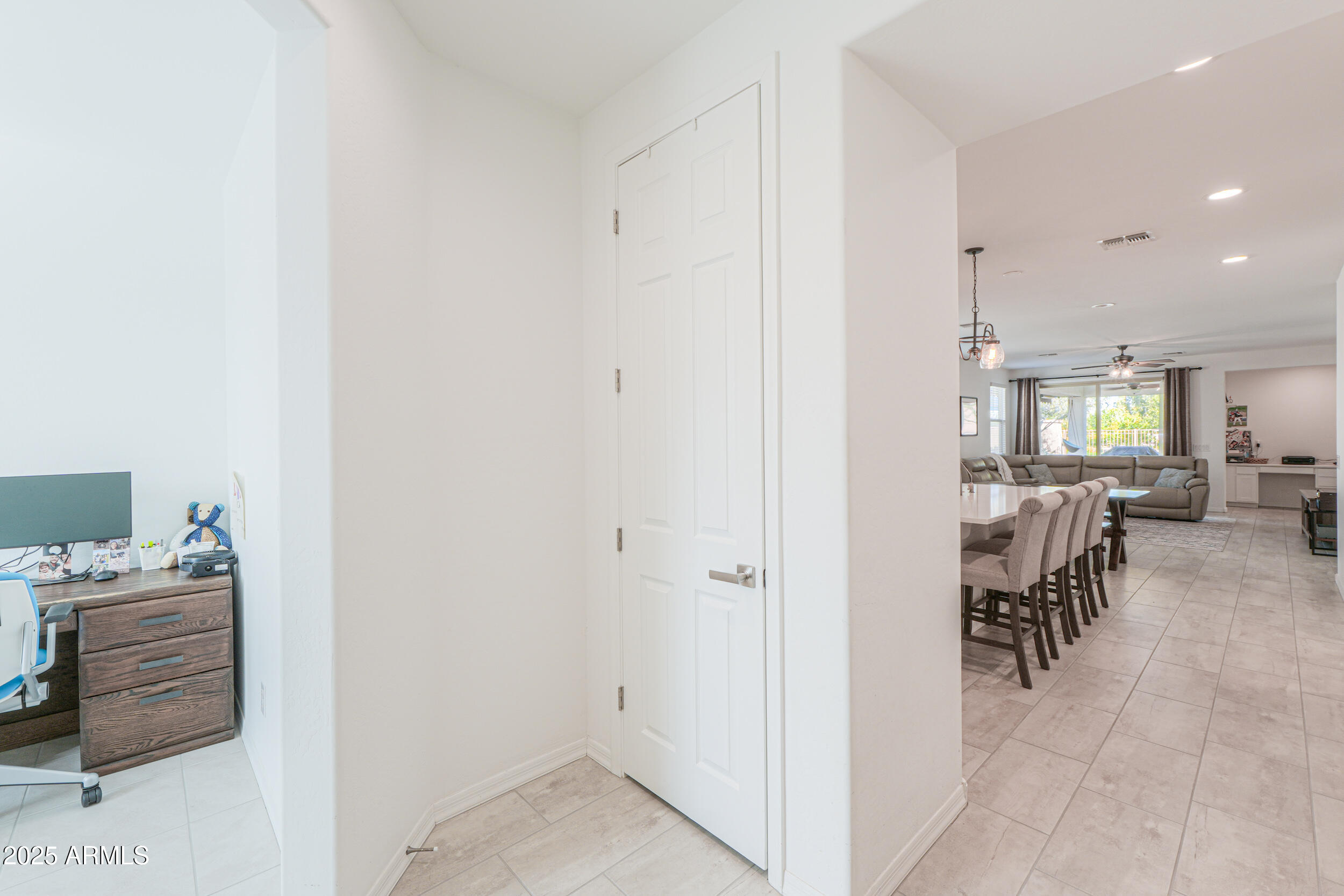 44202 West Palo Olmo Road Maricopa, AZ 85138 - Photo 3 of 32 a hallway with dining table and chairs