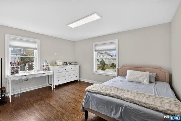 a view of a workspace with furniture and a bookshelf
