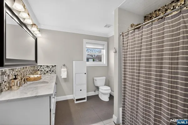 a utility room with a sink washer and dryer