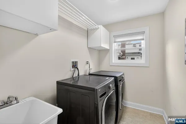 a living room with furniture and a gym machine