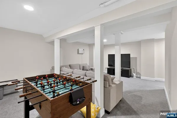 a living room with furniture and a chair