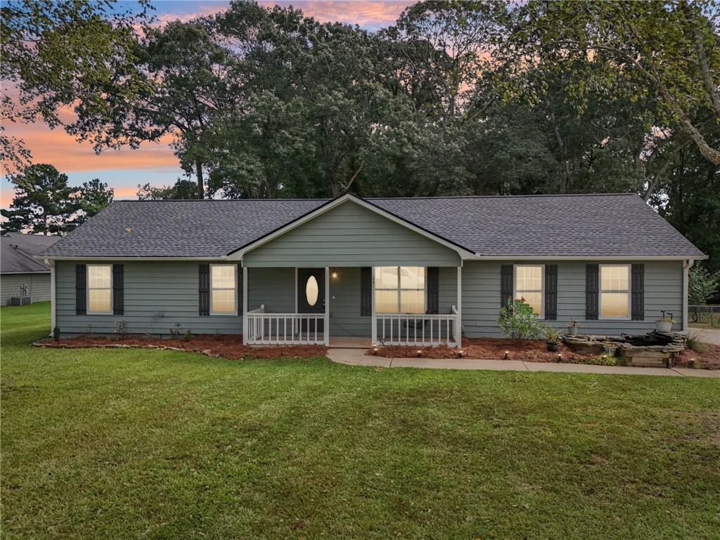 a front view of a house with a yard