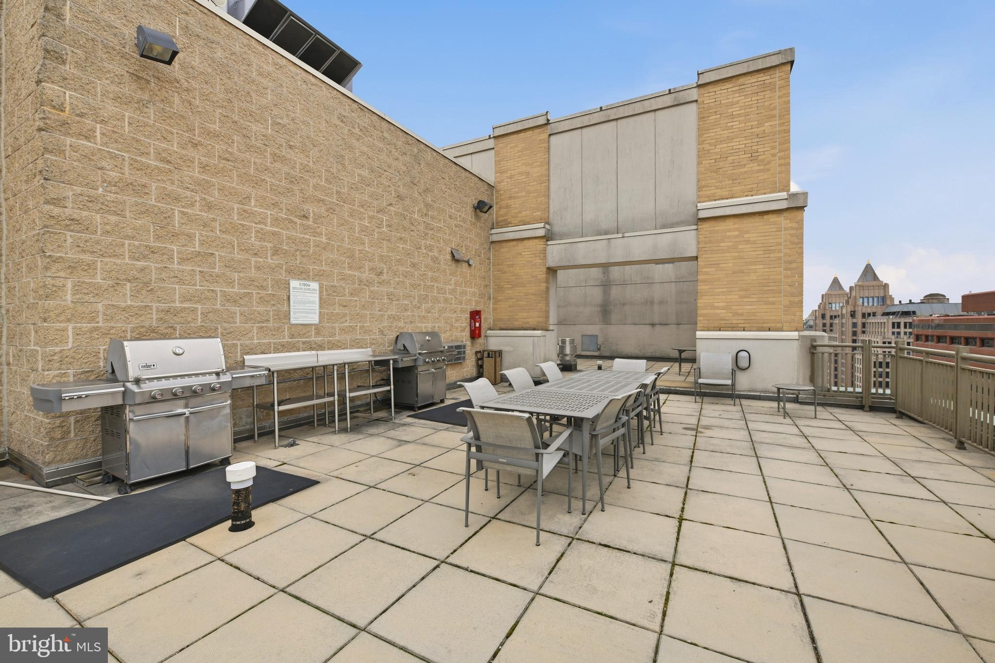 1150 K Street Northwest, Unit 1109 Washington, DC 20005 - Photo 22 of 33 a backyard of a house with seating space