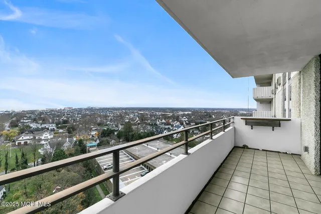 a view of a living room with a table and a vase