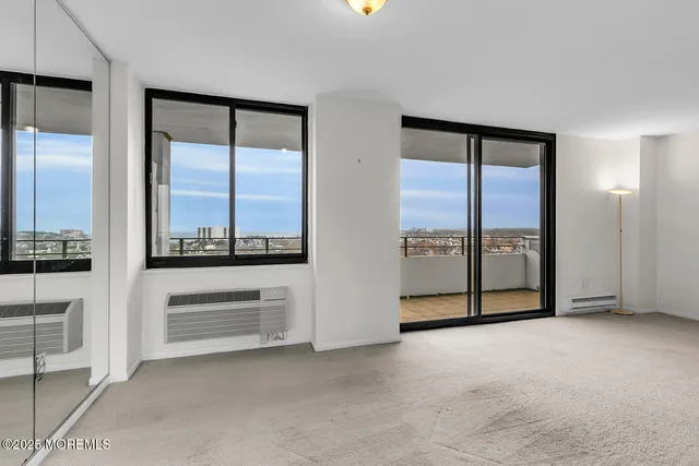 a view of empty room with a fireplace
