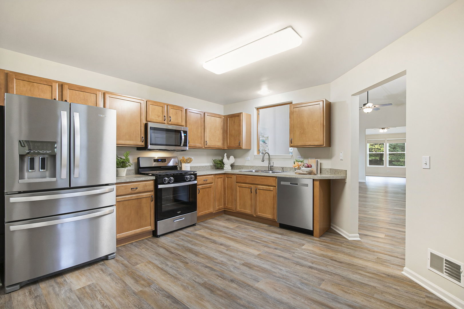 626 South Curran Road Round Lake, IL 60073 - Photo 13 of 25 a kitchen with stainless steel appliances granite countertop a refrigerator stove and oven