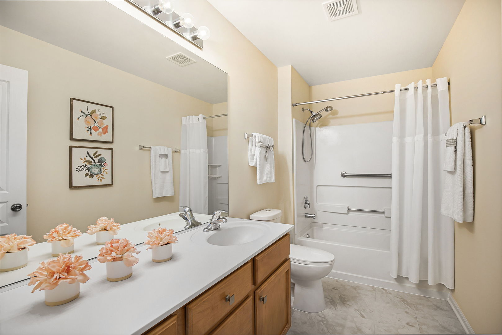 626 South Curran Road Round Lake, IL 60073 - Photo 21 of 25 a bathroom with a shower sink vanity mirror and toilet