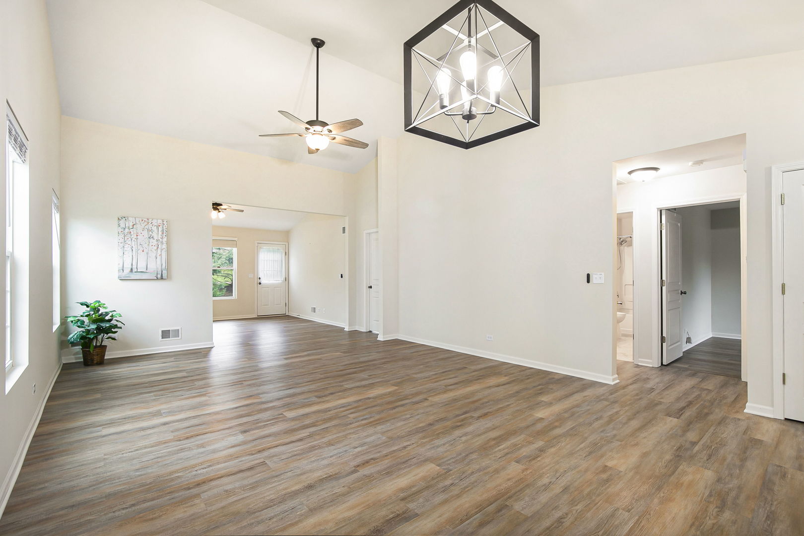 626 South Curran Road Round Lake, IL 60073 - Photo 4 of 25 wooden floor in an empty room with a window