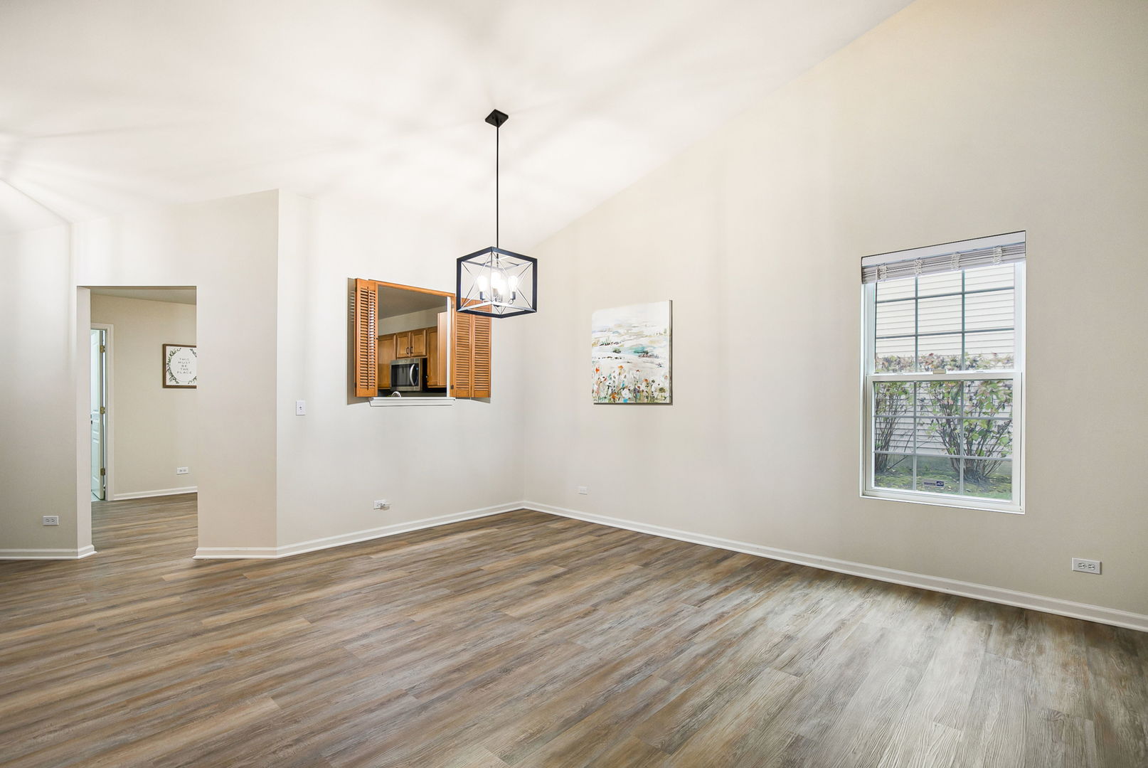 626 South Curran Road Round Lake, IL 60073 - Photo 6 of 25 a view of empty room with wooden floor and window