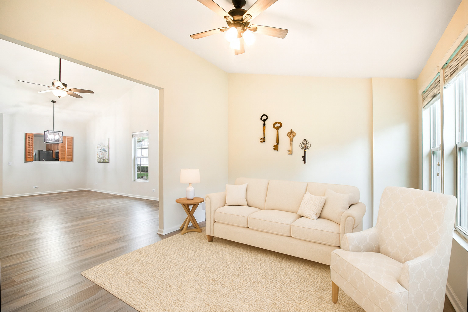 626 South Curran Road Round Lake, IL 60073 - Photo 8 of 25 a living room with furniture and a chandelier