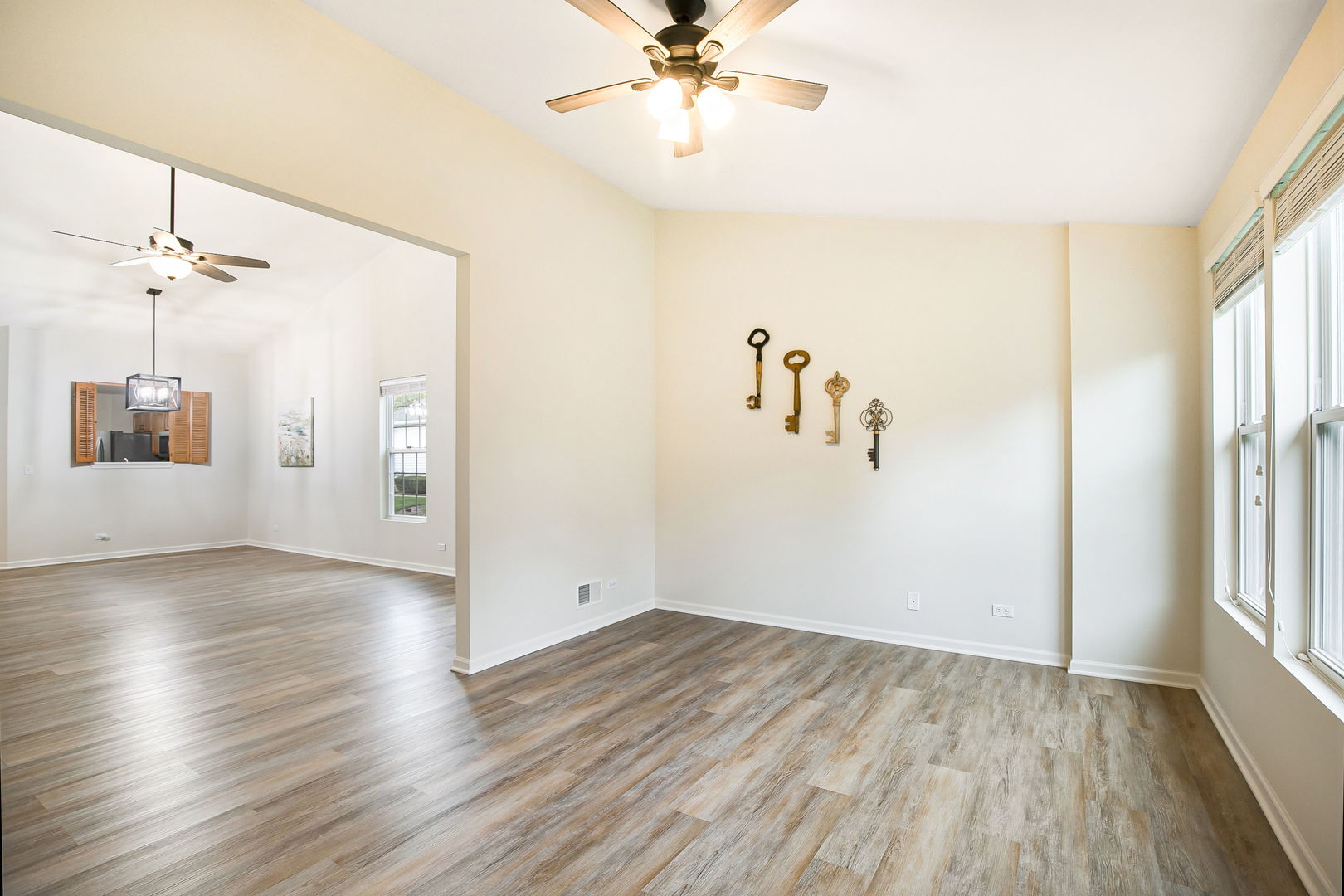 626 South Curran Road Round Lake, IL 60073 - Photo 9 of 25 wooden floor in an empty room with a window