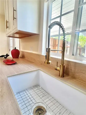 a kitchen with a sink and a window