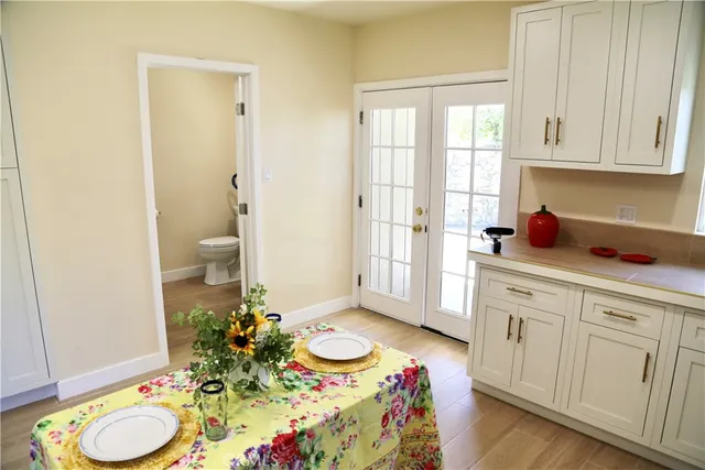 a spacious bathroom with mirror and shower
