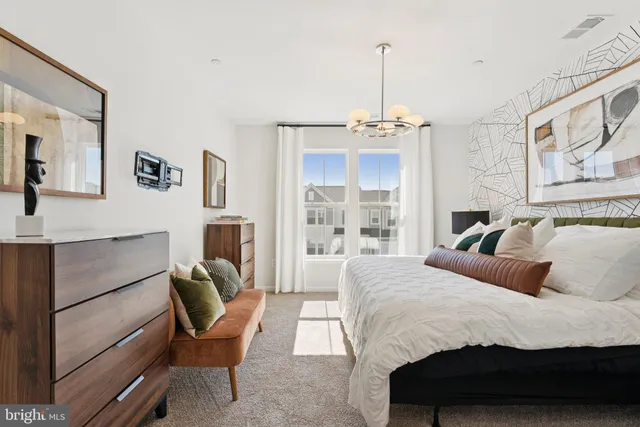 a bedroom with bed and furniture