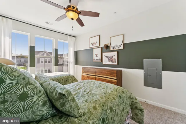 a bathroom with a double vanity sink toilet and shower