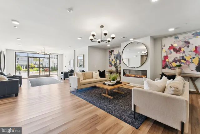 a kitchen with a dining table chairs and white cabinets