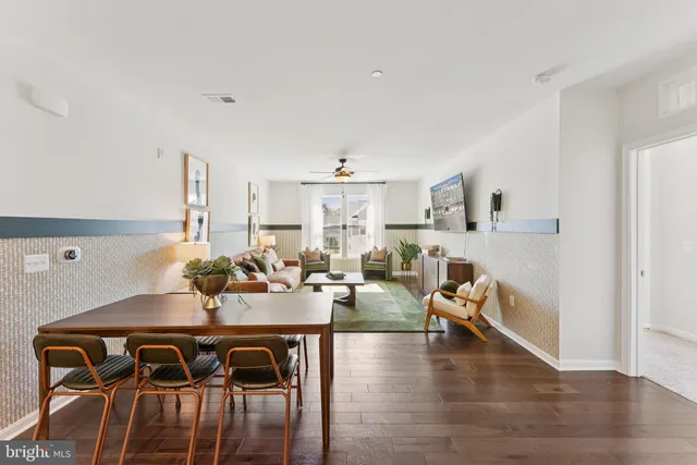 a view of a livingroom with furniture and entryway
