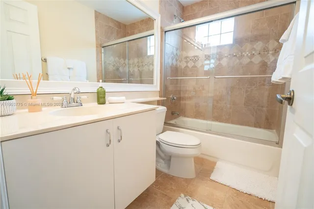 a balcony with furniture and a garden