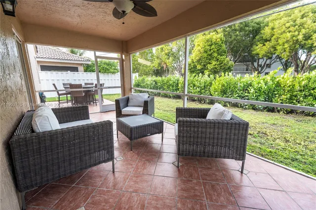 a outdoor living space with furniture and garden view