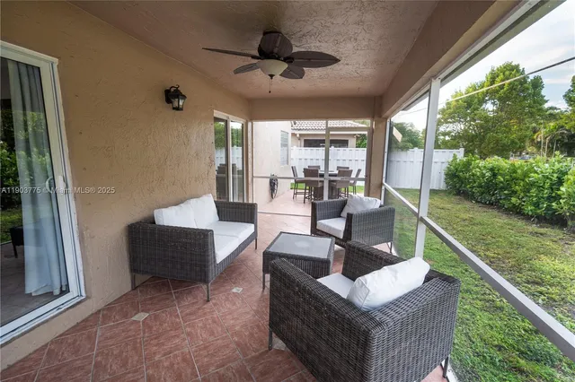 a view of a yard with a tree