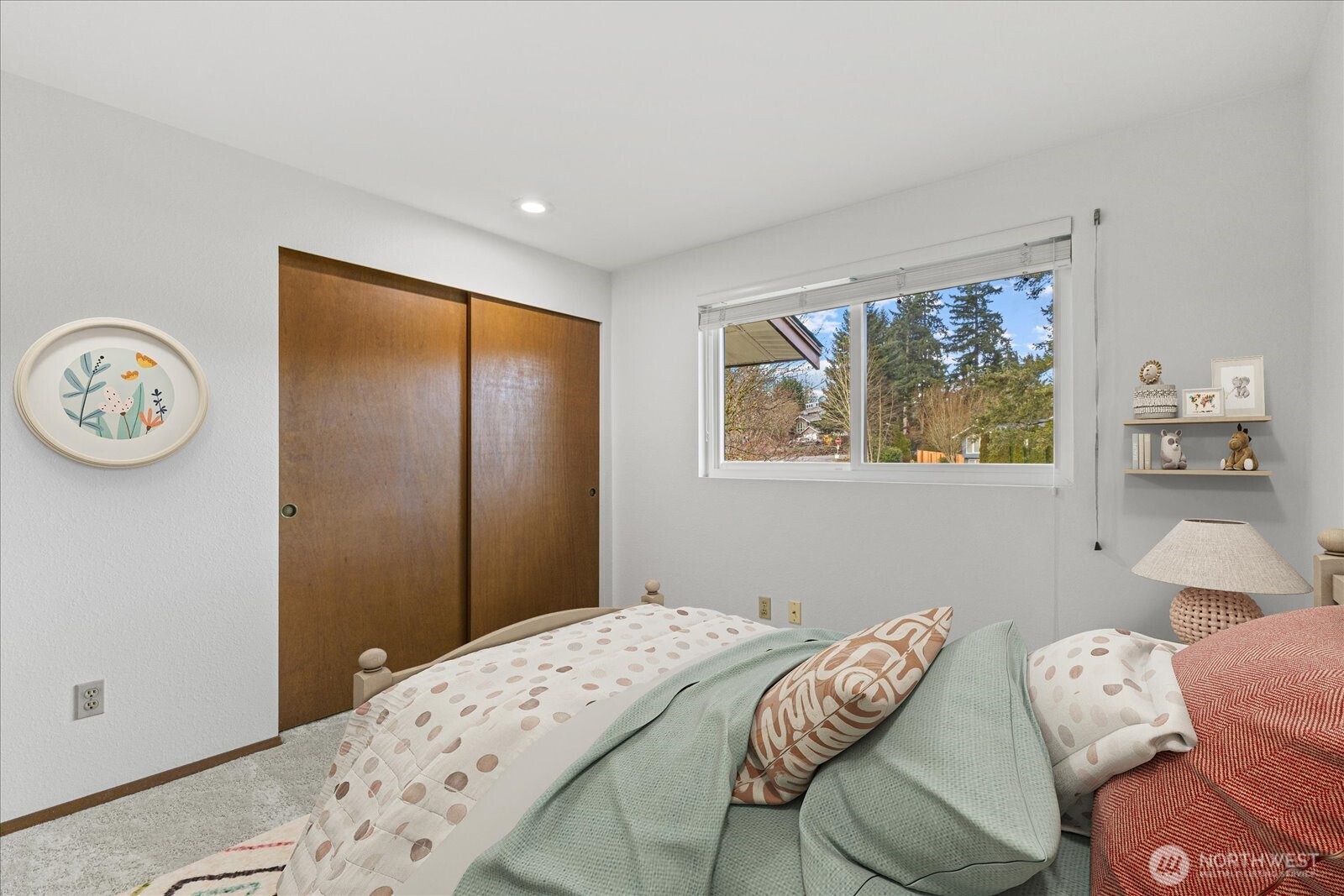 12121 Northeast 161st Street Bothell, WA 98011 - Photo 11 of 22 a bedroom with a bed and a window