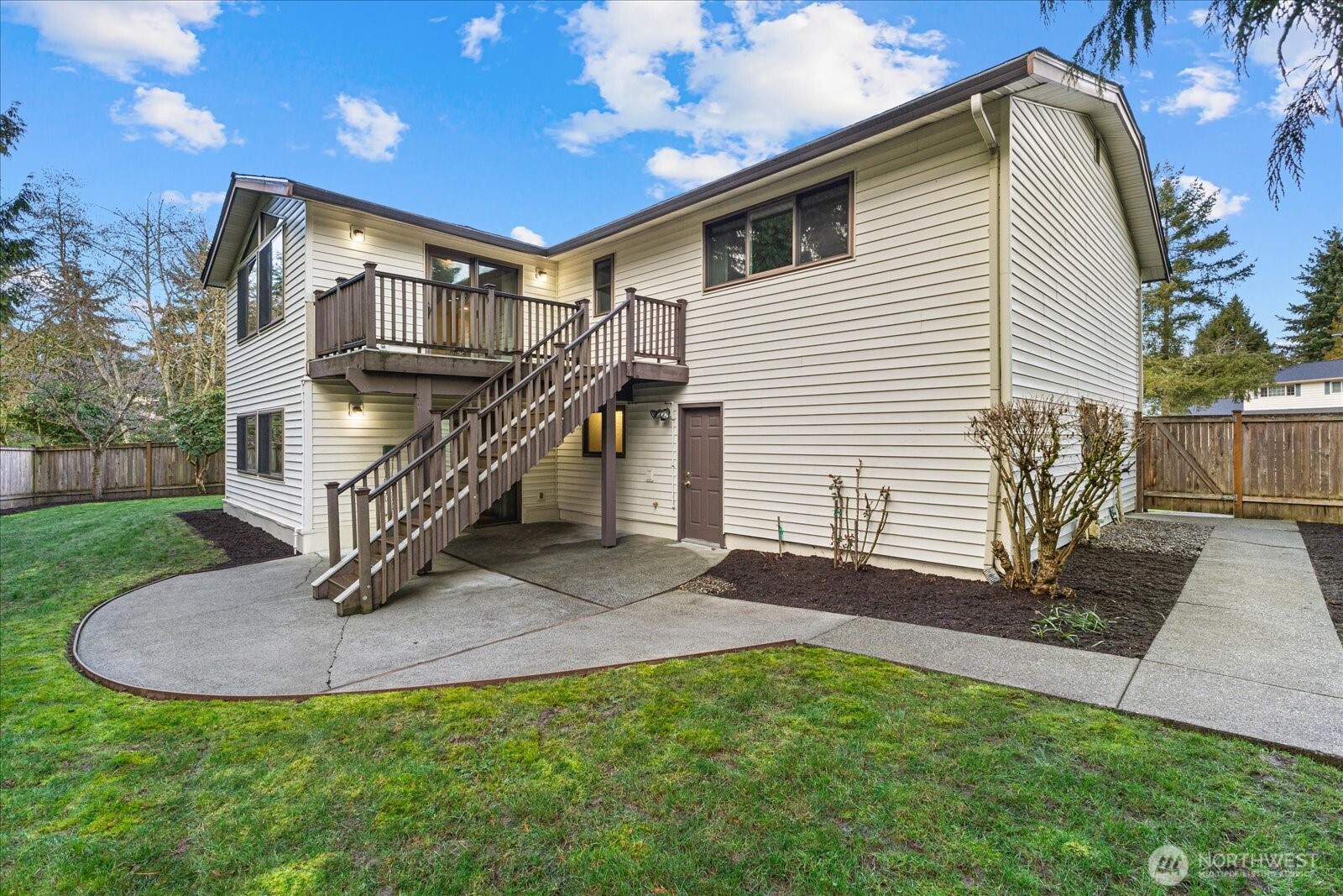 12121 Northeast 161st Street Bothell, WA 98011 - Photo 17 of 22 a view of a house with a yard